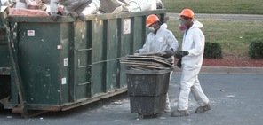 Water Damage Condon Technicians Removing Debris To Street Dumpster