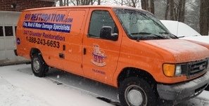 Water Damage Huson Van At Winter Residential Job Site