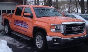 Water Damage Restoration Truck At Winter Flooding Site